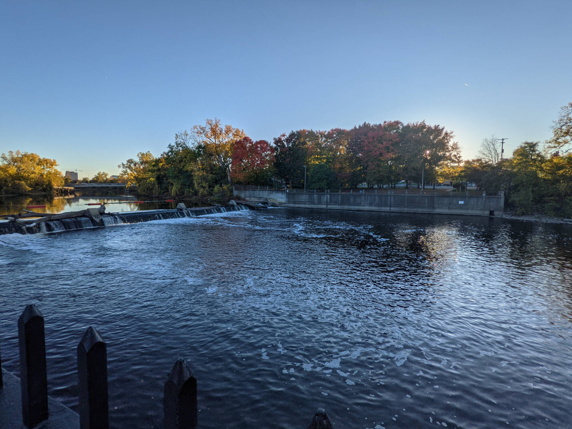 A scenic view of the Grand River near Brenke Fish Ladder in Lansing, Michigan.